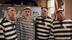 A barbershop quartet dressed as prisoners entertain guests at a saloon in Fort Leavenworth, Kansas, also known as "Prison City."